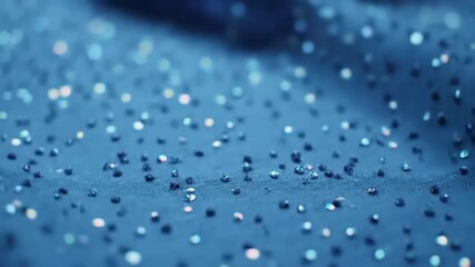 Blue fabric shimmering with beads for evening wear, bokeh background, macro shot - Powered by Adobe