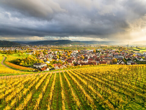 Rainy weather over vineyards and village in Remstal valley Germany