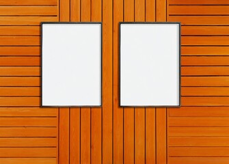 Two vertical blank posters on orange wooden wall