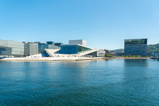 Opera house and modern cityscape with Munch museum in Oslo waterfront
