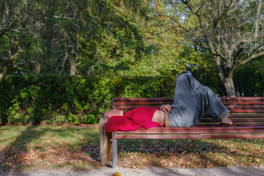 Woman relaxing on park bench practicing mindfulness and self-reflection