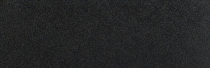 Fototapeta premium Dark black granular texture background, glittery sparkle effect, seamless abstract design, modern luxurious backdrop, elegant festive wallpaper, premium digital graphic.