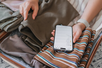 Minimalist travel packing with capsule wardrobe and digital checklist