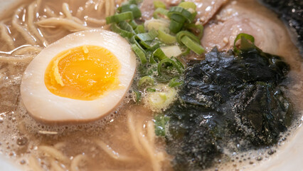 Delicious tonkotsu ramen bowl with delicious char siu above.