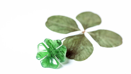Detail of four-leaf clovers  on background