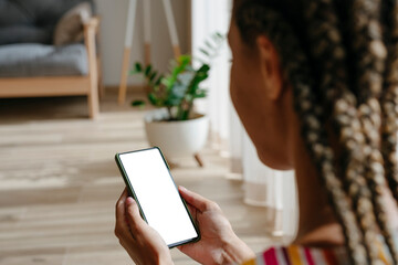 Young woman using smart phone at home