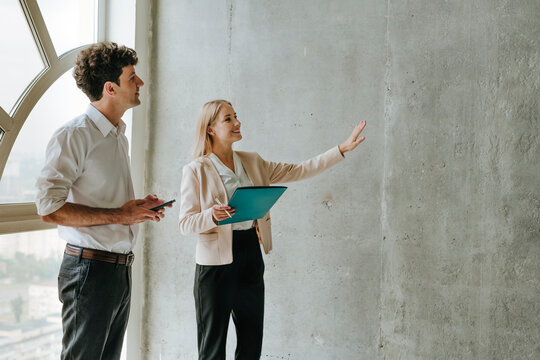 Realtor showing new apartment to customer during business meeting