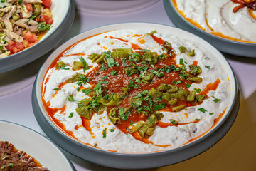 Mediterranean cuisine, olive oil, healthy and delicious  salad varieties with green vegetables.Vegetarian and vegan healty food, open buffet in a luxury hotel. Meze varieties, salad bar.