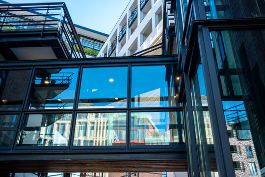 Modern architecture facade revealing structure, symmetry, geometry and reflection, strengthened by minimalism fused with strategic urban design and polished architectural detail