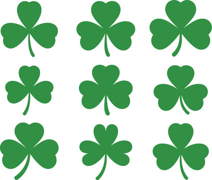 Collection of various green shamrock clover symbols representing luck and Irish heritage, isolated on a white background