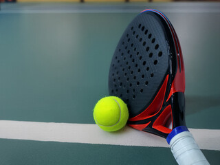 Padel Racket and Ball on Court Line