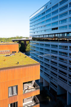 Modern architecture housing in an urban development area highlighting contrast, minimalism and facade lines in Liljeholmen Stockholm with an emphasized green roof