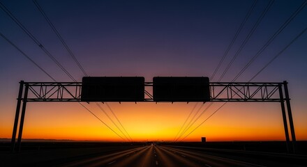 Dramatic Sunset Over Highway With Overhead Sign Reflecting Stunning Colors