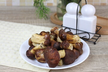 Wild mushrooms on the kitchen table waiting to be cooked