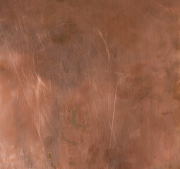 Scratched red copper with natural lighting. Red scratched copper metal texture shiny. 