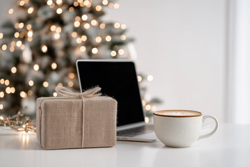 Laptop and Wrapped Present on Bright White Background