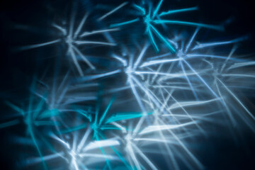 White and turquoise sparklers bokeh, festive abstract photo for wallpapers and prints