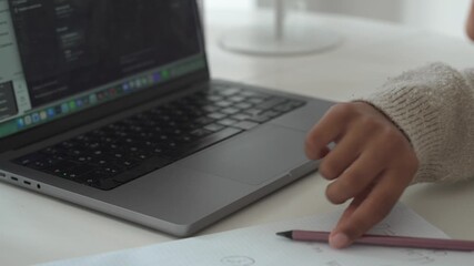 Closeup hands of African American typing laptop. Student child girl study use laptop. Distance learning online education. School girl type at home with digital tablet computer and doing school - Powered by Adobe