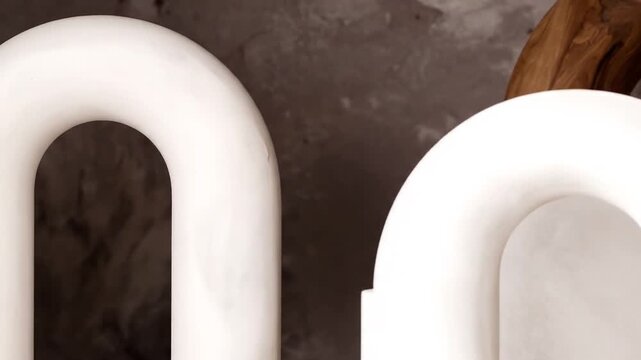 Abstract arrangement of white curved structures with a complementary wooden element. Contrasting textures