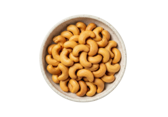 Isolated cashew nuts in a bowl ready to eat tasty and healthy snack on table nutrition