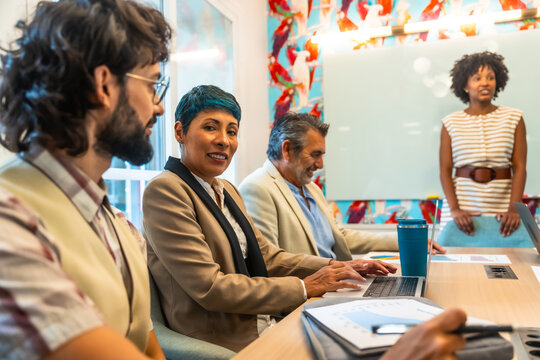 Diverse colleagues collaborating and discussing in an office meeting