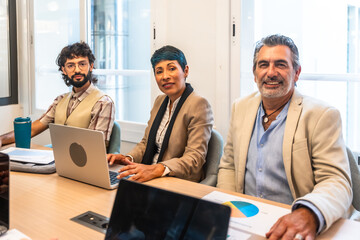 Diverse business people collaborating in a modern office meeting