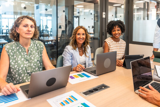 Diverse businesswomen collaborating during a corporate office meeting