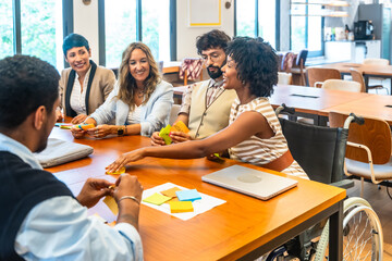 Diverse colleagues collaborating at a meeting in a modern office
