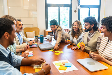 Diverse business team collaborating during brainstorming meeting in coworking office