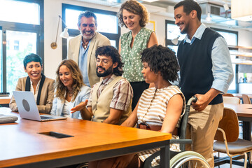 Diverse corporate team collaborating in inclusive coworking office