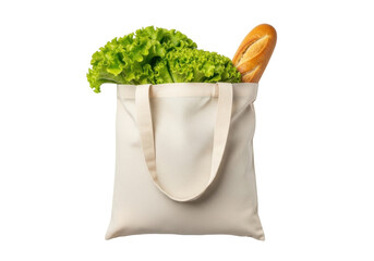 Isolated canvas tote bag filled with leafy green lettuce and a crusty baguette bread loaf