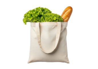 Isolated canvas tote bag filled with leafy green lettuce and a crusty baguette bread loaf