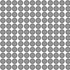 Repeating pattern of intricate floral designs in black and white creating a textured background effect