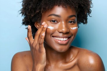 Beautiful woman applying face cream for skincare routine on blue background