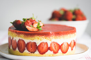 French strawberry cake Fraisier on white plate.