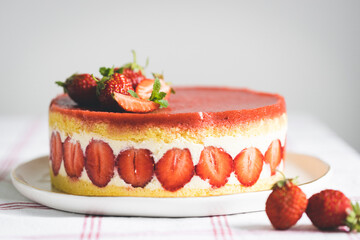 French strawberry cake Fraisier on white plate.