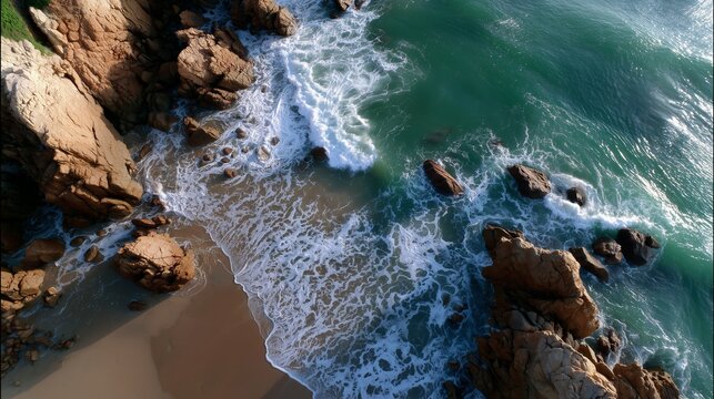Scenic ocean view with rocky shore and crashing waves at sunset
