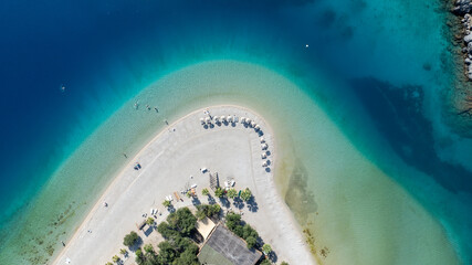 Aerial summer travel scene showing &Ouml;l&uuml;deniz Blue Lagoon&rsquo;s vivid turquoise sea
