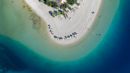 Aerial summer travel scene showing &Ouml;l&uuml;deniz Blue Lagoon&rsquo;s vivid turquoise sea