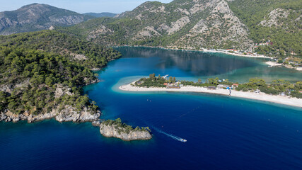Scenic aerial footage capturing the bright blue lagoon and surrounding natural beauty.