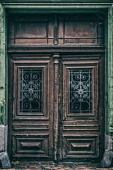 ARCHITECTURE AND ELEMENTS - A very old door in a very old tenement house