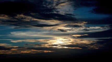 Expansive sky with dynamic cloud formations at dawn or dusk, warm colors near horizon,