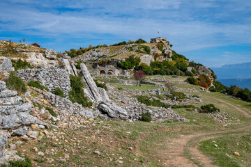 An autumn landscape decorated with yellow, red, and orange leaves in Burdur Bucak. The road to the ancient city of Kremna and the scenery in the autumn atmosphere.