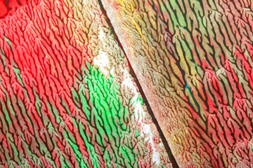 Thick vibrant abstract acrylic paint texture with lines splatters