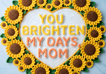Crochet sunflowers surrounding a heart-shaped typography “You Brighten My Days, Mom,”