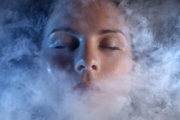 Fototapeta premium Woman Relaxation in Facial Steam Therapy - Tranquility and Skincare Bliss.