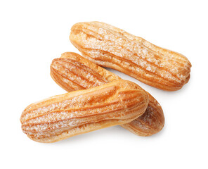 Tasty eclairs with powdered sugar isolated on white, top view