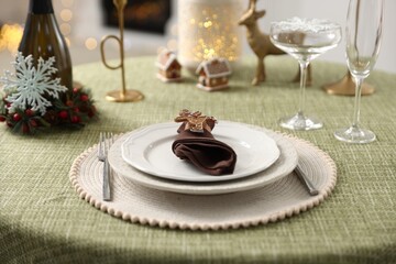 Festive table setting with Christmas decor indoors, closeup