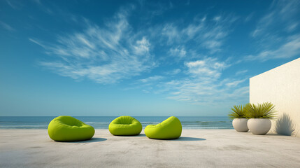 Modern beach terrace with green lounge chairs and ocean view under blue sky