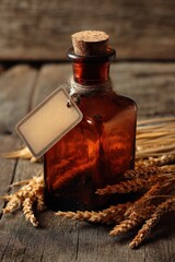 Vintage amber glass bottle with a cork stopper and blank label, surrounded by ears of wheat
